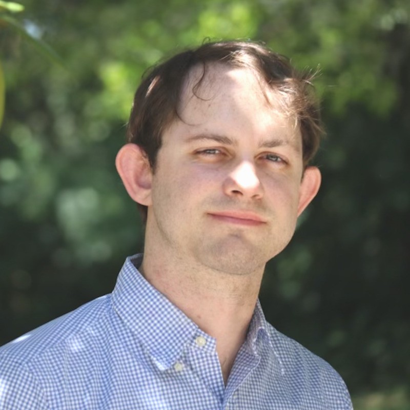 A professional headshot of Philip Peterson